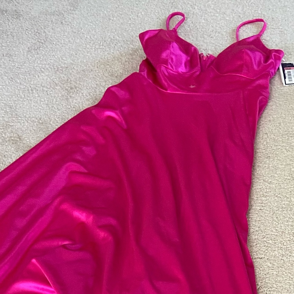 New with tags stretchy hot pink prom dress. Size 9 juniors